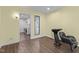 Salon style room with shampoo bowl, wood floors, and access to the laundry room with a view to the outdoors at 237 Jason Way, Youngsville, NC 27596