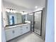 Modern bathroom with double vanity, walk-in shower, and neutral color palette at 2403 Whitewing Ln, Wendell, NC 27591