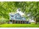 Spacious backyard featuring a well-maintained lawn and multi-level deck at 244 Mantle Dr, Clayton, NC 27527