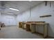 Expansive unfinished basement featuring concrete flooring, utility access, and double doors at 244 Mantle Dr, Clayton, NC 27527