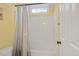 Bathroom with a shower-tub, a window for natural light, and a toilet at 244 Mantle Dr, Clayton, NC 27527