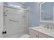 Bathroom with tiled shower and glass door, neutral color palette, and vanity sink at 244 Mantle Dr, Clayton, NC 27527