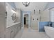 Bright bathroom with modern fixtures, dual shower heads, and a luxurious soaking tub at 244 Mantle Dr, Clayton, NC 27527