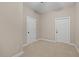 Neutral bedroom featuring two doors and neutral carpet at 244 Mantle Dr, Clayton, NC 27527