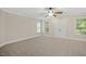 Spacious bedroom with natural light and a ceiling fan at 244 Mantle Dr, Clayton, NC 27527