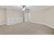 Spacious bedroom featuring neutral tones, carpeted floors, and built-in storage cabinets at 244 Mantle Dr, Clayton, NC 27527