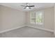 Bedroom featuring a ceiling fan, carpeted flooring, and a window with bright natural light at 244 Mantle Dr, Clayton, NC 27527