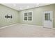 Spacious bonus room featuring a large window and neutral carpet at 244 Mantle Dr, Clayton, NC 27527