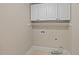 Laundry room with overhead cabinets and hookups for washer and dryer at 244 Mantle Dr, Clayton, NC 27527