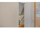 View of the home's staircase featuring wood handrail and runner at 244 Mantle Dr, Clayton, NC 27527