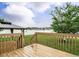 Wood deck overlooking a well-maintained backyard with fencing and gazebo at 253 Middle Landing Dr, Smithfield, NC 27577