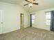 Bright bedroom with neutral walls, carpet, ceiling fan and two windows at 253 Middle Landing Dr, Smithfield, NC 27577