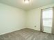 Neutral bedroom featuring carpet, pale walls, one window and a ceiling light at 253 Middle Landing Dr, Smithfield, NC 27577