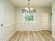 Bright dining area featuring chandelier lighting and easy access to backyard at 253 Middle Landing Dr, Smithfield, NC 27577