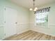 Dining room with chair rail, and a chandelier at 253 Middle Landing Dr, Smithfield, NC 27577