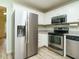 Well-lit kitchen featuring stainless steel appliances and white cabinets at 253 Middle Landing Dr, Smithfield, NC 27577