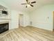 Bright living room with fireplace, updated flooring, and neutral paint at 253 Middle Landing Dr, Smithfield, NC 27577