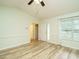 Light-filled living room with modern flooring, fan, and ample natural light at 253 Middle Landing Dr, Smithfield, NC 27577