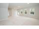 Spacious finished basement with natural light from windows and light colored carpet at 263 Hopewell Branch Ct, Smithfield, NC 27577