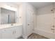 Clean bathroom features a single vanity, a shower-tub combo, and neutral-toned walls at 263 Hopewell Branch Ct, Smithfield, NC 27577
