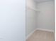 Small closet with carpeted floors and wire shelving, ideal for storage and organization at 263 Hopewell Branch Ct, Smithfield, NC 27577