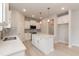 Modern kitchen with white cabinets, stainless steel appliances, an island, and gray backsplash at 263 Hopewell Branch Ct, Smithfield, NC 27577