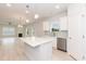 Open kitchen with white cabinets, stainless steel appliances, an island, and pendant lighting at 263 Hopewell Branch Ct, Smithfield, NC 27577