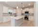Beautiful kitchen with white cabinets, a large island, and modern stainless steel appliances at 263 Hopewell Branch Ct, Smithfield, NC 27577