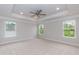 This primary bedroom includes neutral walls, carpet and multiple windows providing great light at 263 Hopewell Branch Ct, Smithfield, NC 27577