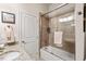 Bathroom with a shower over tub, a granite countertop vanity, and a towel with an 'M' initial at 2633 Beckwith Rd, Apex, NC 27523