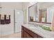 Bathroom featuring a granite countertop vanity, a sink, and towels monogrammed with the letter 'M' at 2633 Beckwith Rd, Apex, NC 27523