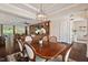 Open concept layout featuring dining area, hardwood floors, and an elegant chandelier at 2633 Beckwith Rd, Apex, NC 27523