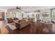 Expansive living room featuring an open floor plan, hardwood floors, and seamless transition to the kitchen and dining area at 2633 Beckwith Rd, Apex, NC 27523