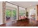 Bright living room featuring a sliding door with access to an outdoor deck with views of the backyard at 2633 Beckwith Rd, Apex, NC 27523