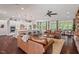 Bright open-concept living area with a kitchen, breakfast bar, dining space, and comfortable seating at 2633 Beckwith Rd, Apex, NC 27523