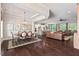 A harmonious blend of kitchen, dining, and living areas featuring hardwood floors and natural light at 2633 Beckwith Rd, Apex, NC 27523