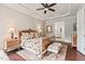 The primary bedroom features a tray ceiling, large windows, and an ensuite bathroom at 2633 Beckwith Rd, Apex, NC 27523