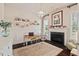 A bright home office featuring a fireplace, hardwood floors, and neutral décor, perfect for productivity at 2633 Beckwith Rd, Apex, NC 27523