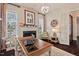 Inviting office space featuring neutral decor, natural light, hardwood floors and a fireplace at 2633 Beckwith Rd, Apex, NC 27523