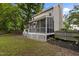 Exterior view of a charming home with a screened porch and well-maintained backyard at 2705 Kempsford Pl, Raleigh, NC 27604