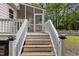 Stairs leading to back porch overlooking a backyard at 2705 Kempsford Pl, Raleigh, NC 27604