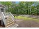 Backyard featuring lawn, wood fence and a fire pit at 2705 Kempsford Pl, Raleigh, NC 27604