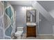 Bathroom featuring tile flooring, shower curtain, and wood vanity at 2705 Kempsford Pl, Raleigh, NC 27604
