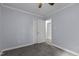 Bedroom features plush carpet, ceiling fan and a closet at 2705 Kempsford Pl, Raleigh, NC 27604