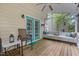 Cozy porch with seating, a ceiling fan, and screened windows at 2705 Kempsford Pl, Raleigh, NC 27604