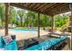 View of in-ground pool and patio with pergola at 2912 Turning Brook Ln, Raleigh, NC 27616