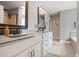Bathroom featuring a double sink vanity, tile flooring, and modern fixtures at 2912 Turning Brook Ln, Raleigh, NC 27616