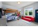 Bright bedroom featuring bunk beds, pull out sofa, and large window allowing an abundance of light at 2912 Turning Brook Ln, Raleigh, NC 27616