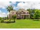 Beautiful, well-maintained two-story brick house with a lush green lawn and mature landscaping at 2912 Turning Brook Ln, Raleigh, NC 27616