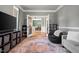 Inviting living room with hardwood floors, stylish rug, and cozy furniture at 2912 Turning Brook Ln, Raleigh, NC 27616
